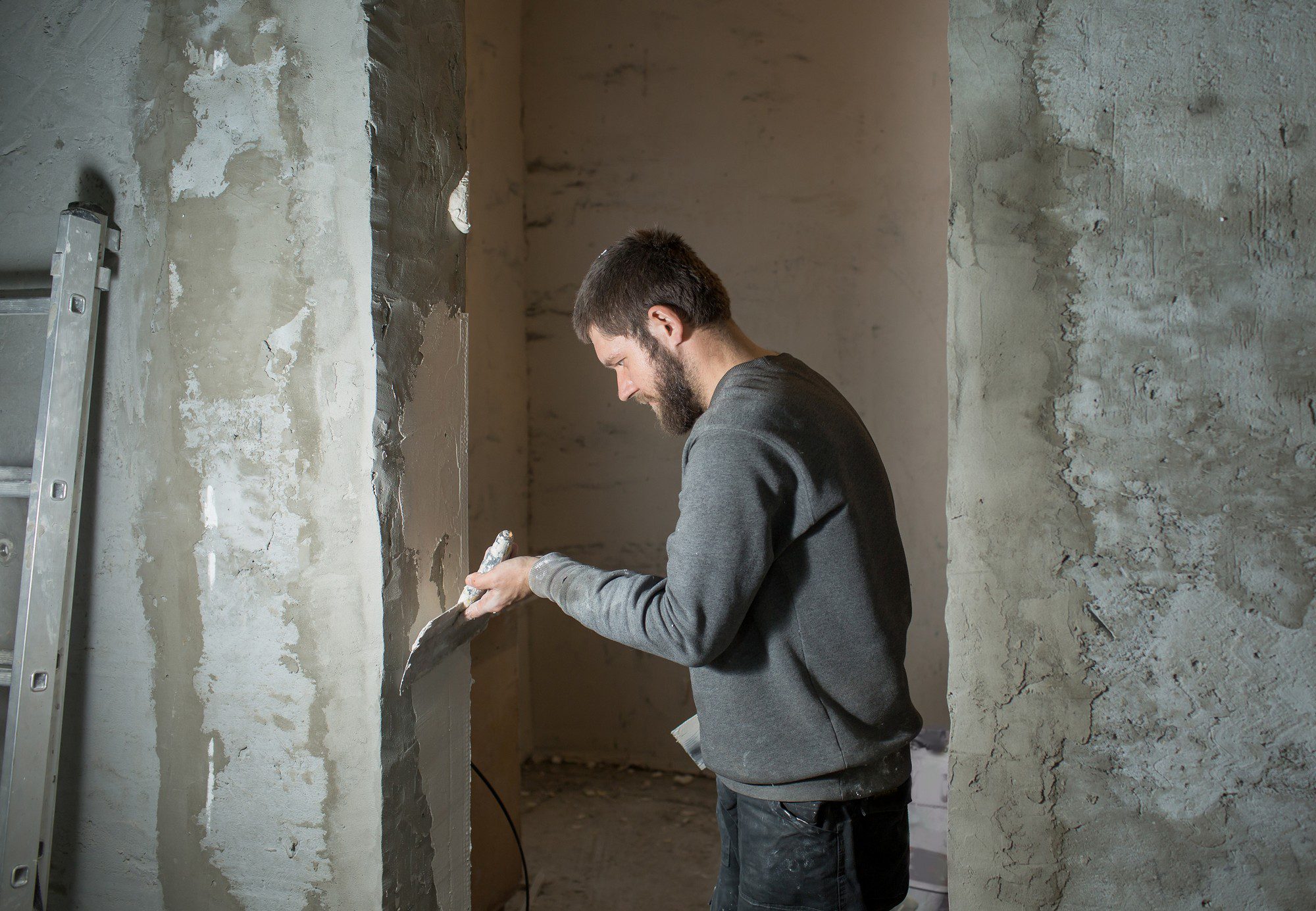 A Male Plasterer Plasters A Concrete Wall With A S 2022 11 11 07 14 26 Utc